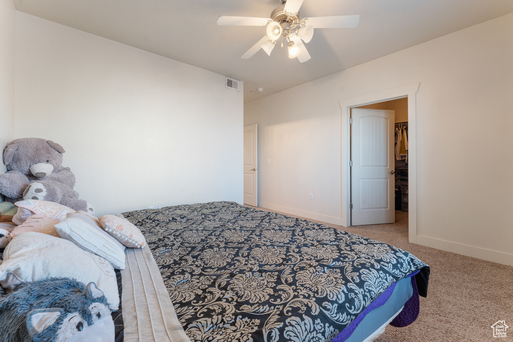 Bedroom with carpet floors and ceiling fan