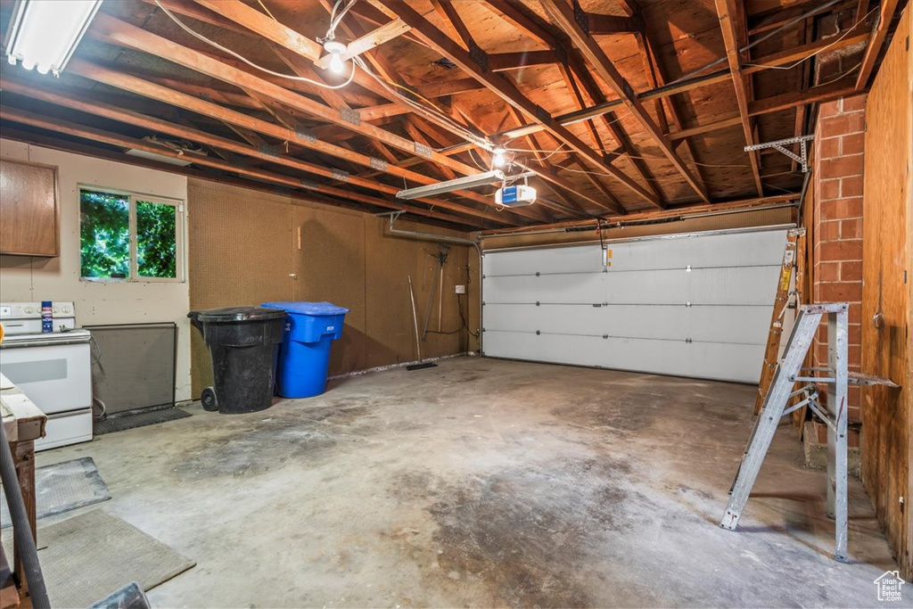 Garage featuring a garage door opener