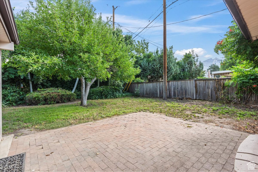 Fenced backyard featuring a patio area