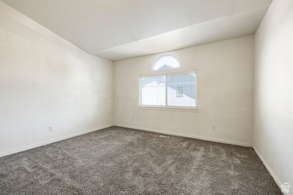 Empty room with carpet flooring
