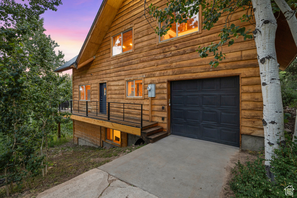 View of home's exterior with concrete driveway