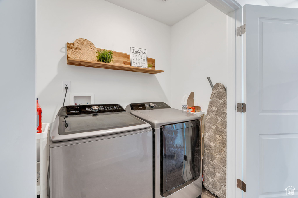 Laundry area featuring independent washer and dryer