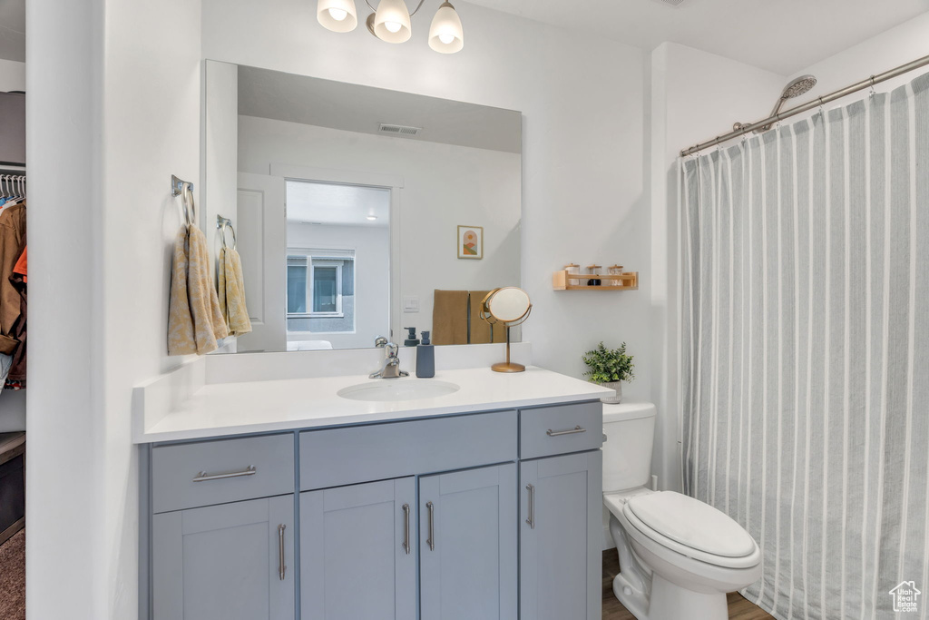 Full bath with vanity and a shower with curtain