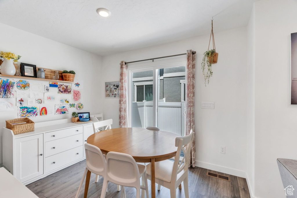 Dining room featuring wood finished floors and baseboards