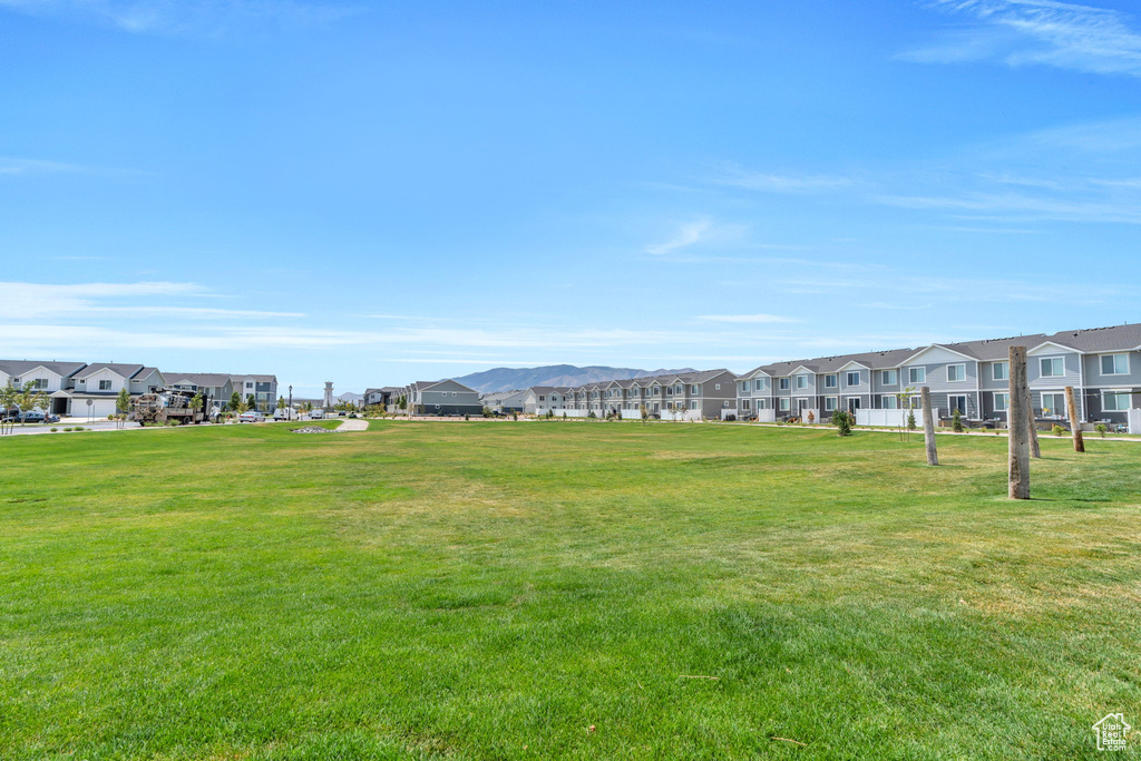 View of home\'s community with a residential view and a yard