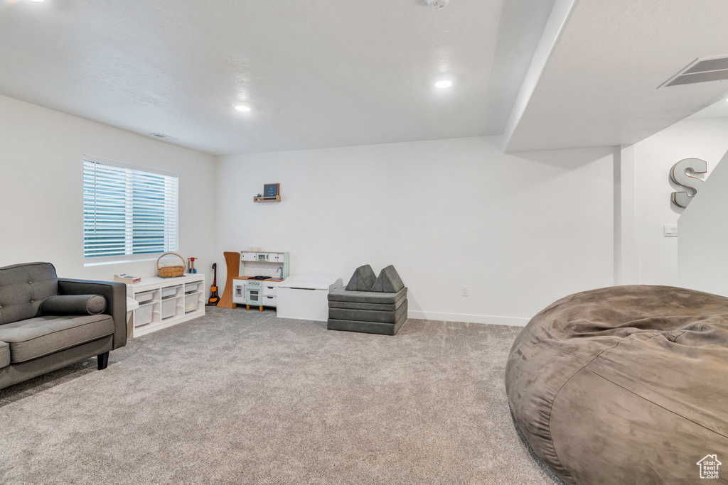 Sitting room featuring carpet flooring and recessed lighting