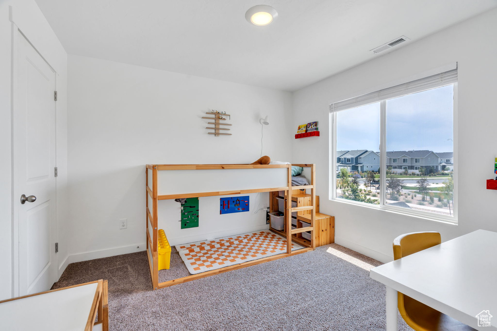 Bedroom with carpet and baseboards