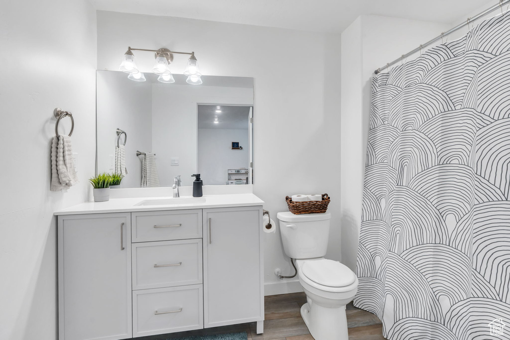 Bathroom with vanity and wood finished floors