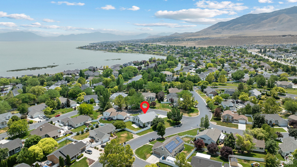 Aerial perspective of suburban area featuring a water and mountain view