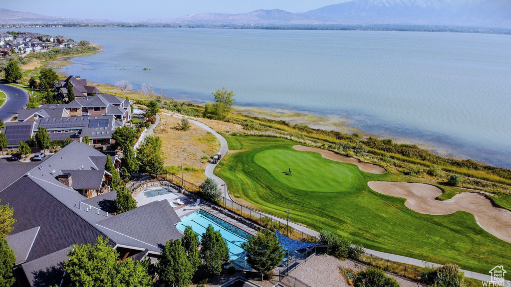 Bird\\\'s eye view of a water and mountain view and a golf club
