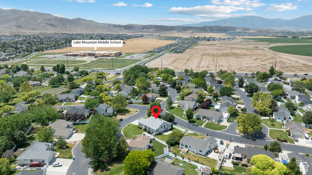 View of property location with a mountain backdrop and nearby suburban area