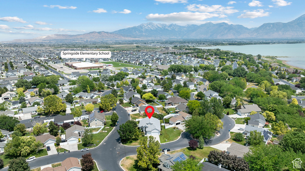 Aerial view of residential area featuring a water and mountain view