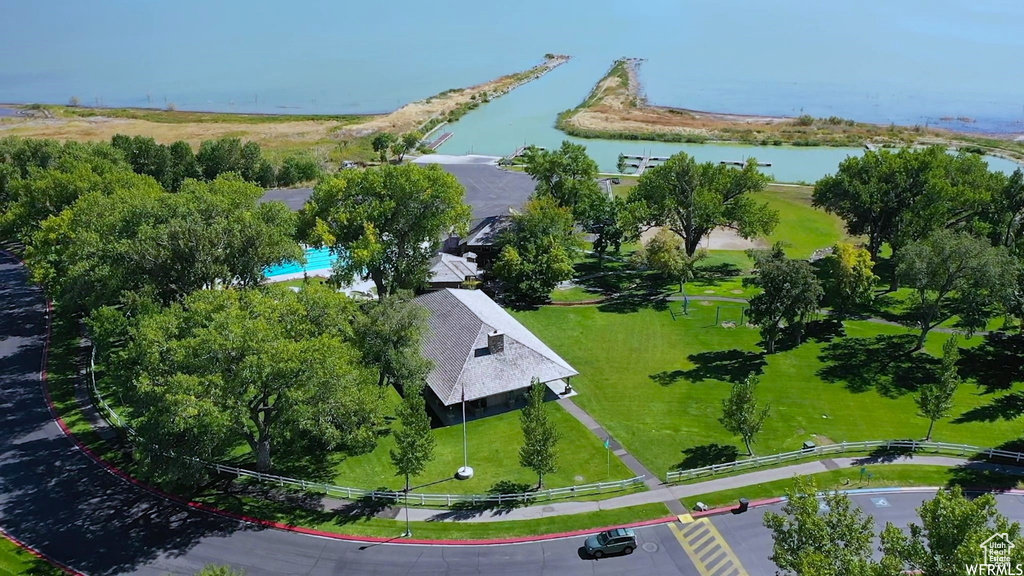 Drone / aerial view of a large body of water and a pool area
