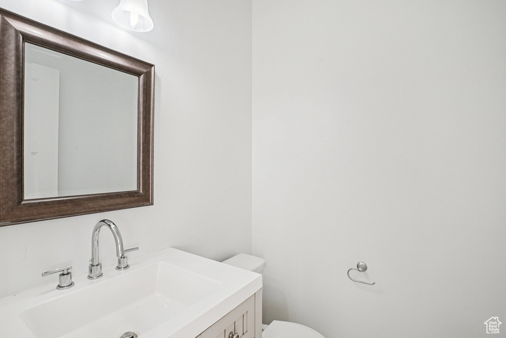 Half bath with toilet and vanity