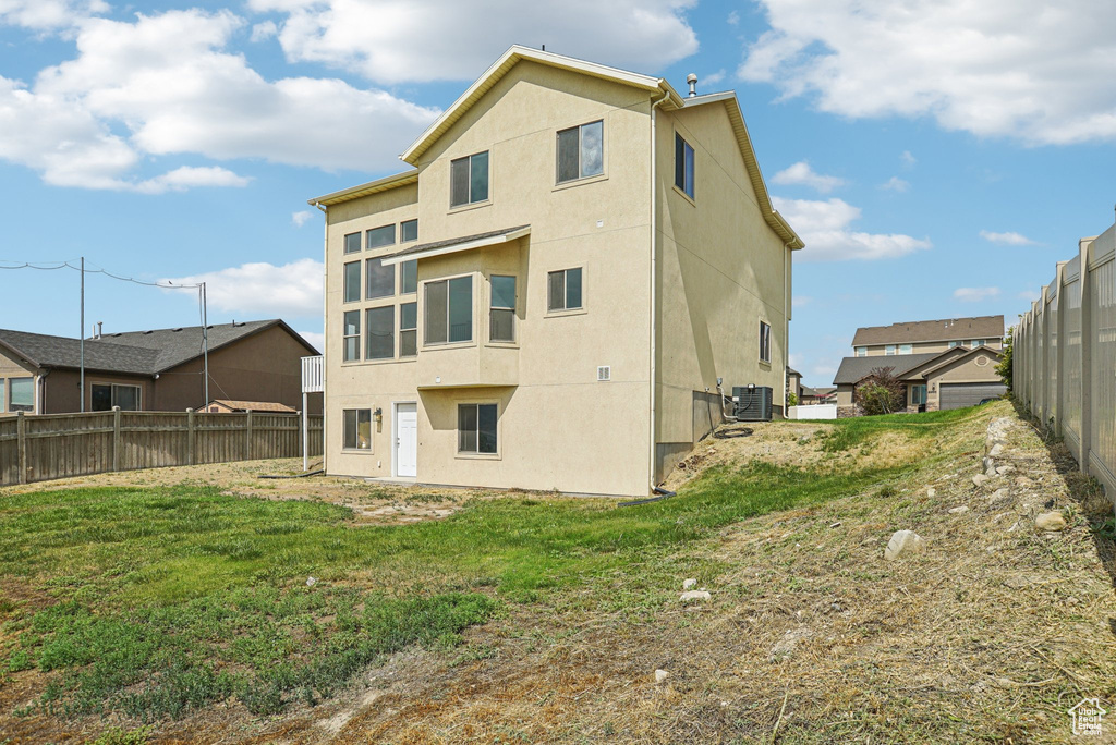 Rear view of house with stucco siding
