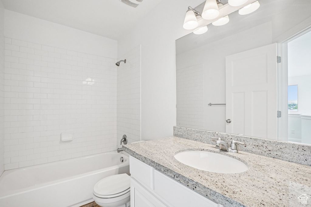 Full bath featuring vanity and  shower combination
