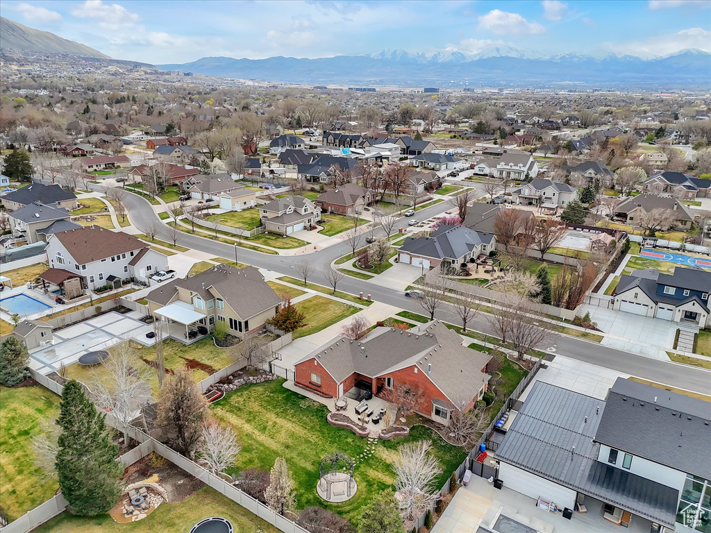 Aerial perspective of suburban area featuring a mountain backdrop