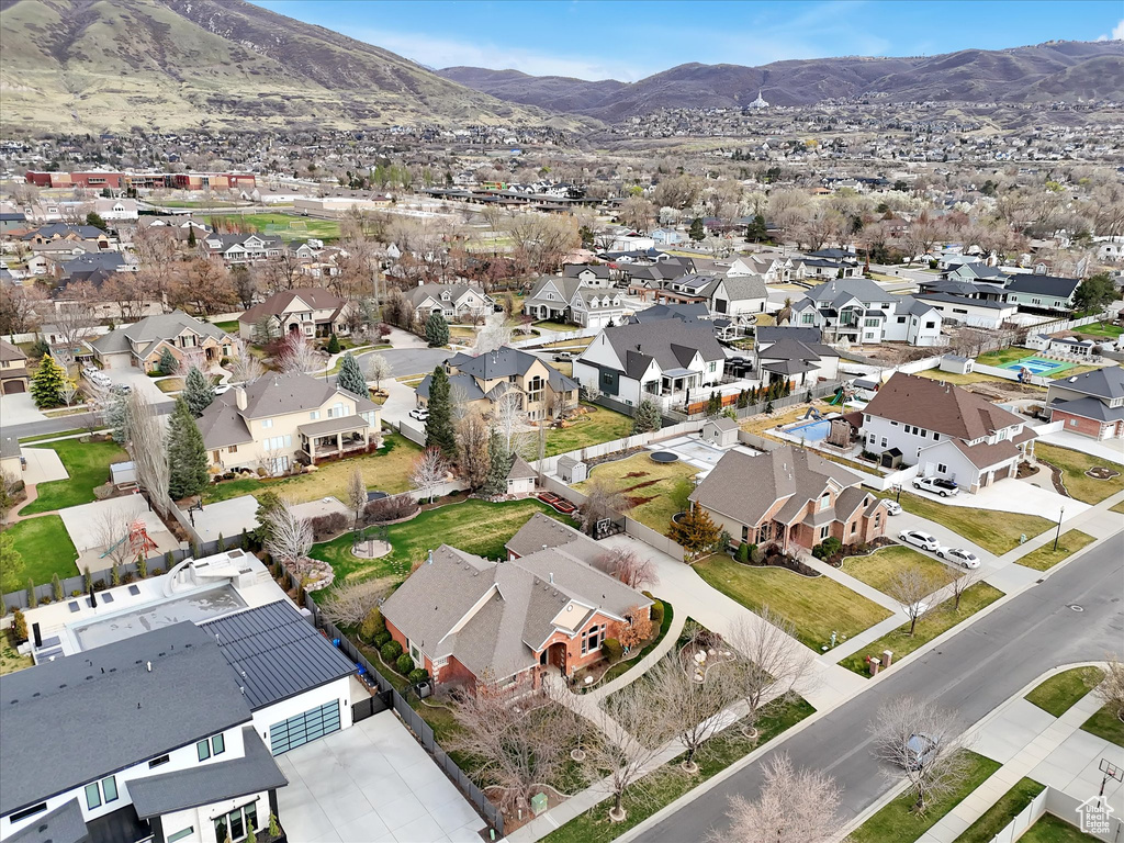 Aerial view of residential area with a mountainous background