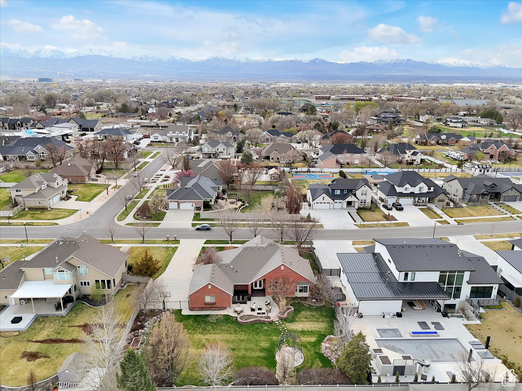 Aerial view of residential area with a mountainous background