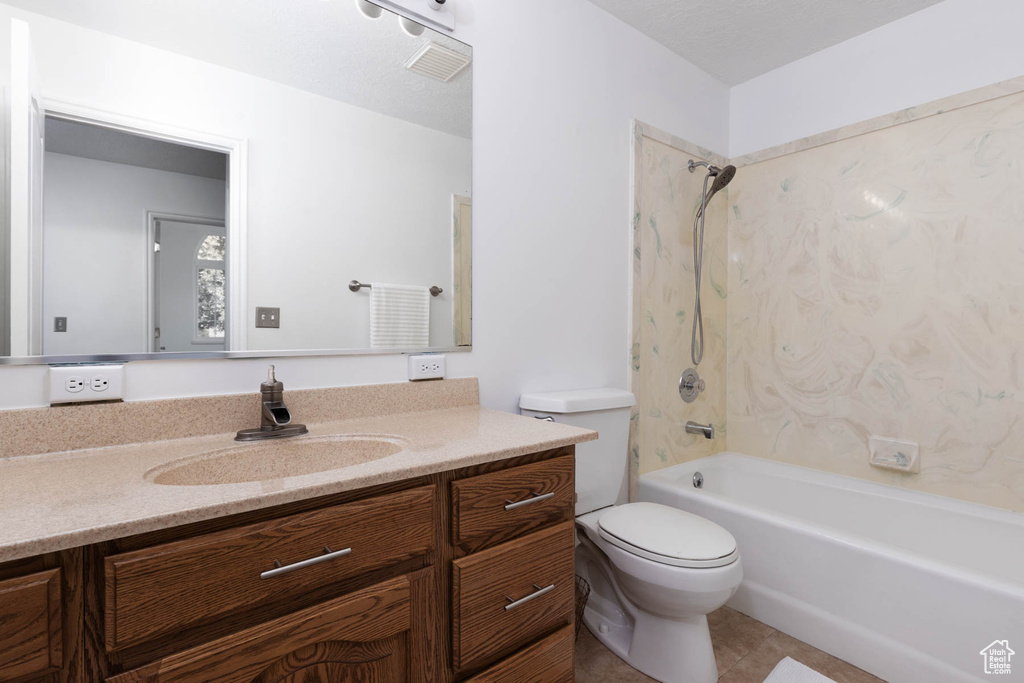 Full bath with vanity, shower / bathtub combination, and tile patterned floors