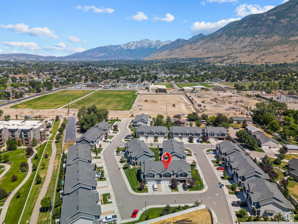 Aerial overview of property\\\'s location featuring mountains and nearby suburban area