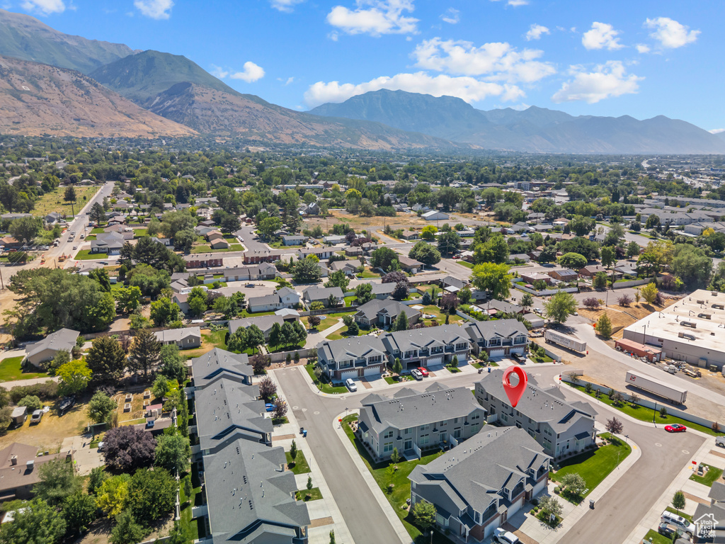 Aerial perspective of suburban area with a mountain backdrop