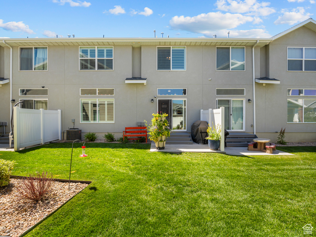 Back of house featuring stucco siding