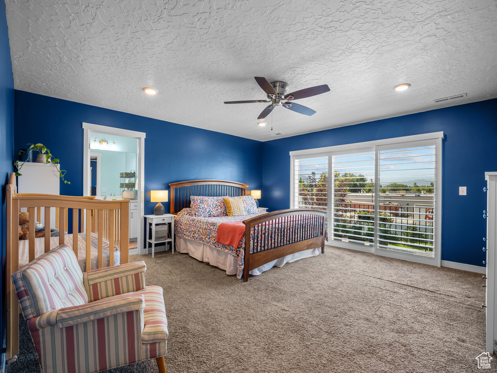 Carpeted bedroom featuring access to outside, a textured ceiling, ceiling fan, and recessed lighting