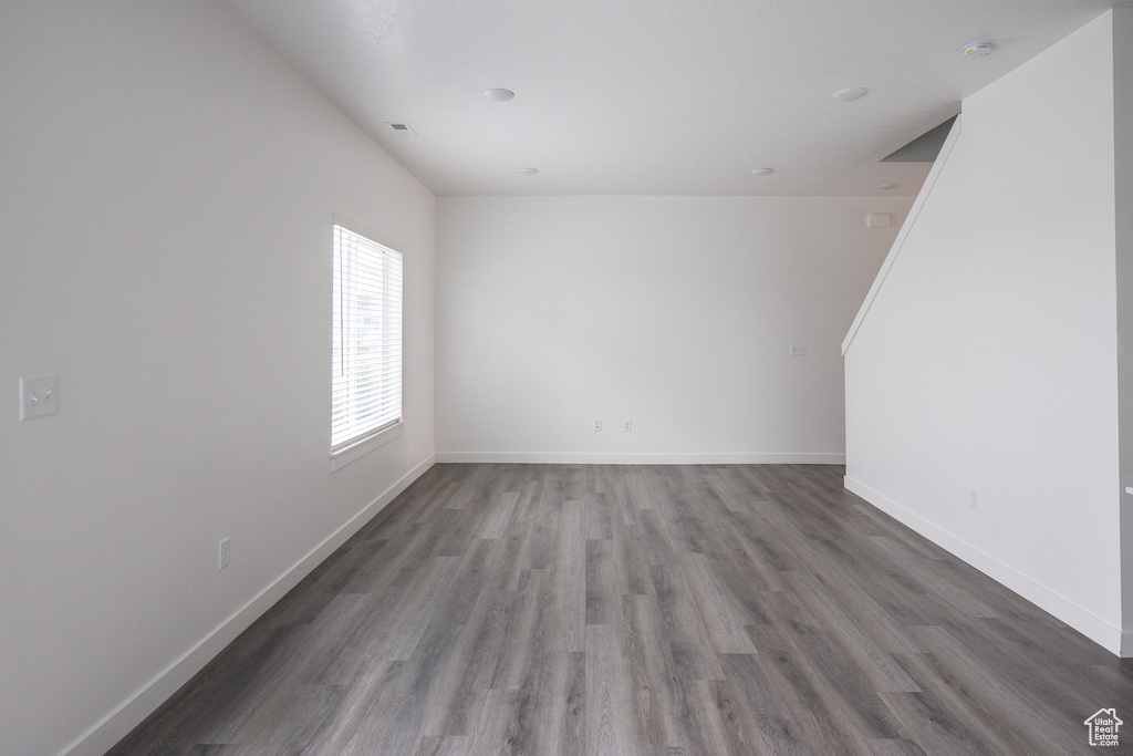 Empty room with wood finished floors and baseboards