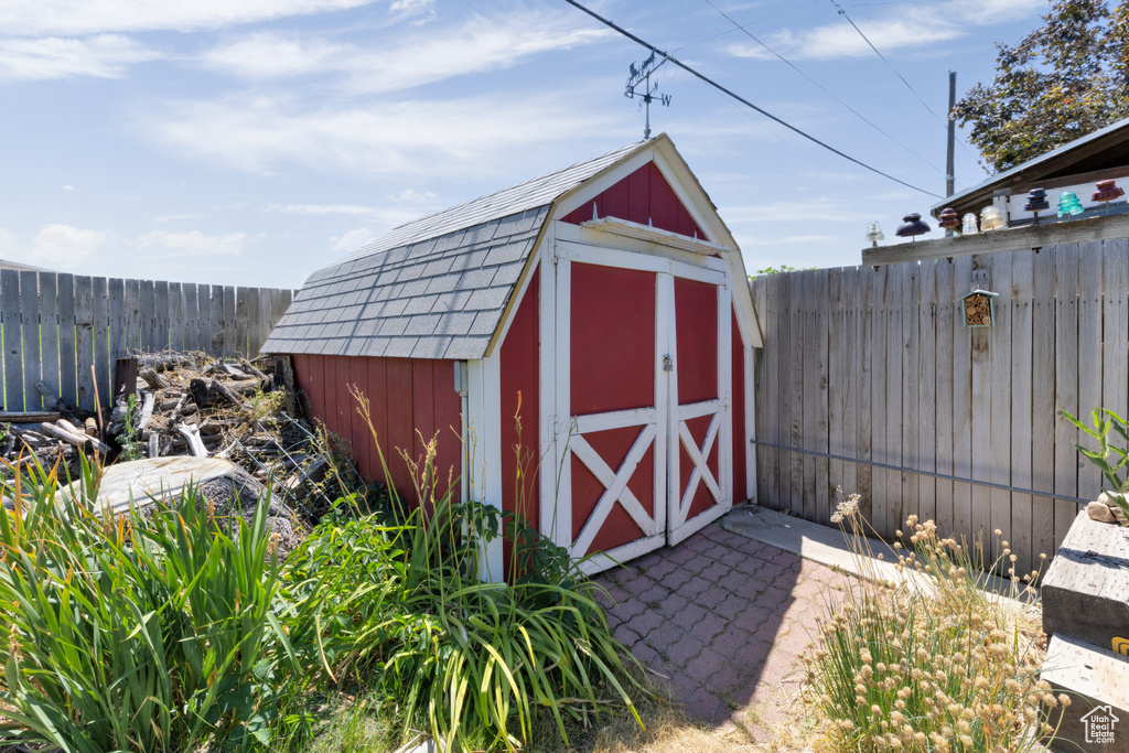View of shed featuring a fenced backyard