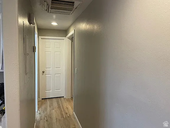 Hall with light wood-type flooring
