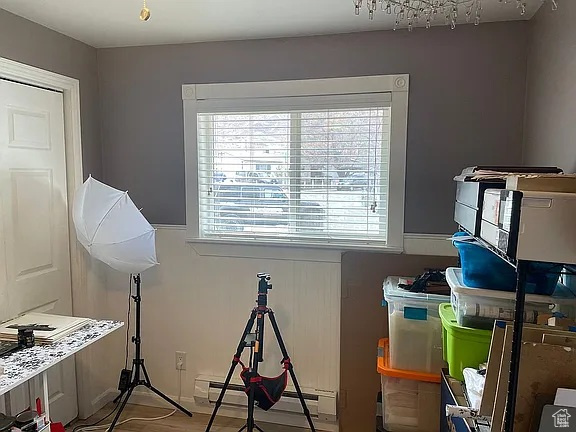 Recreation room with healthy amount of natural light and baseboard heating