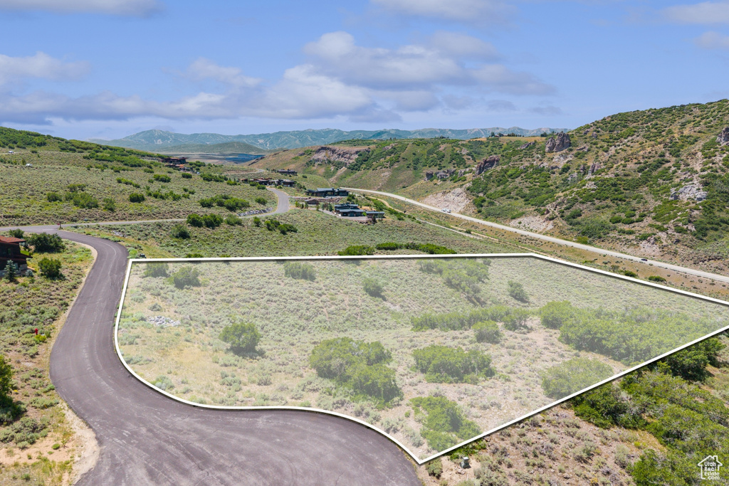 View of rural area featuring property boundaries highlighted and a mountainous background