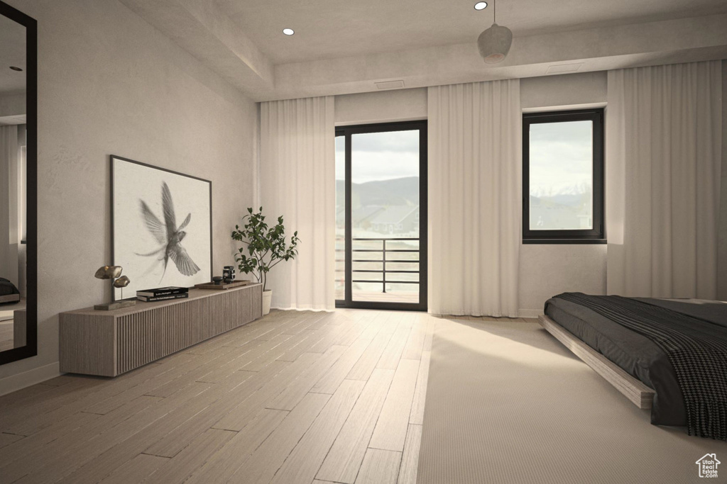 Bedroom with access to exterior, wood finished floors, and recessed lighting