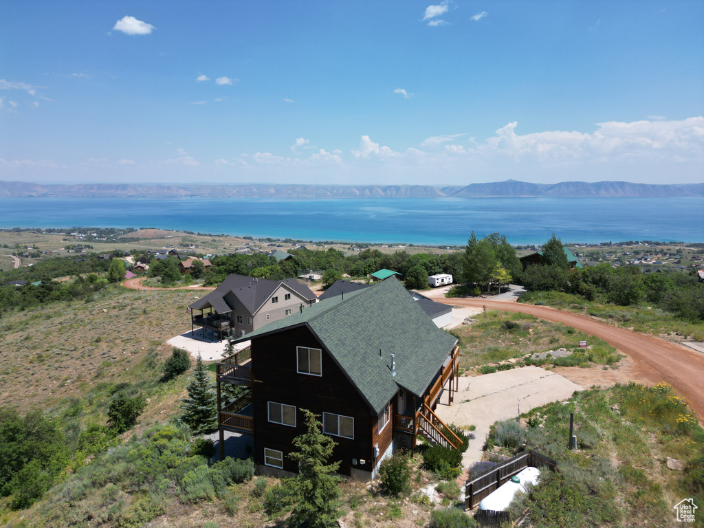 View of subject property featuring a water and mountain view