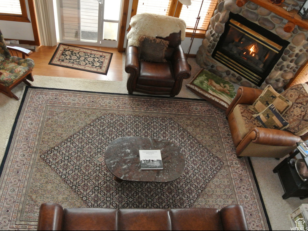 Living room with a fireplace and wood finished floors