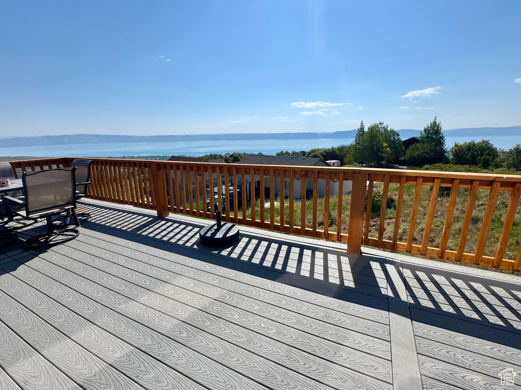 Wooden deck featuring a water view