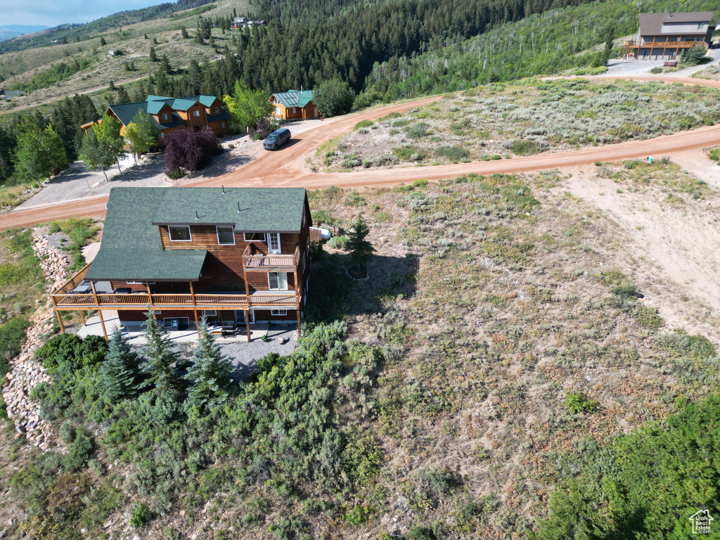 View from above of property featuring a heavily wooded area