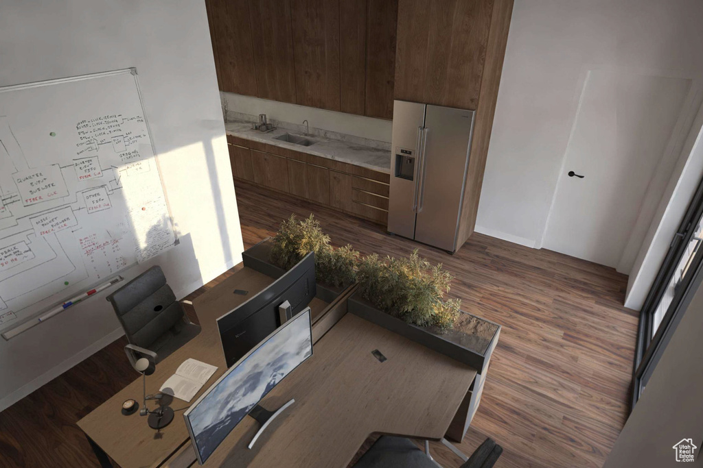 Living room with dark wood-style floors and an office area