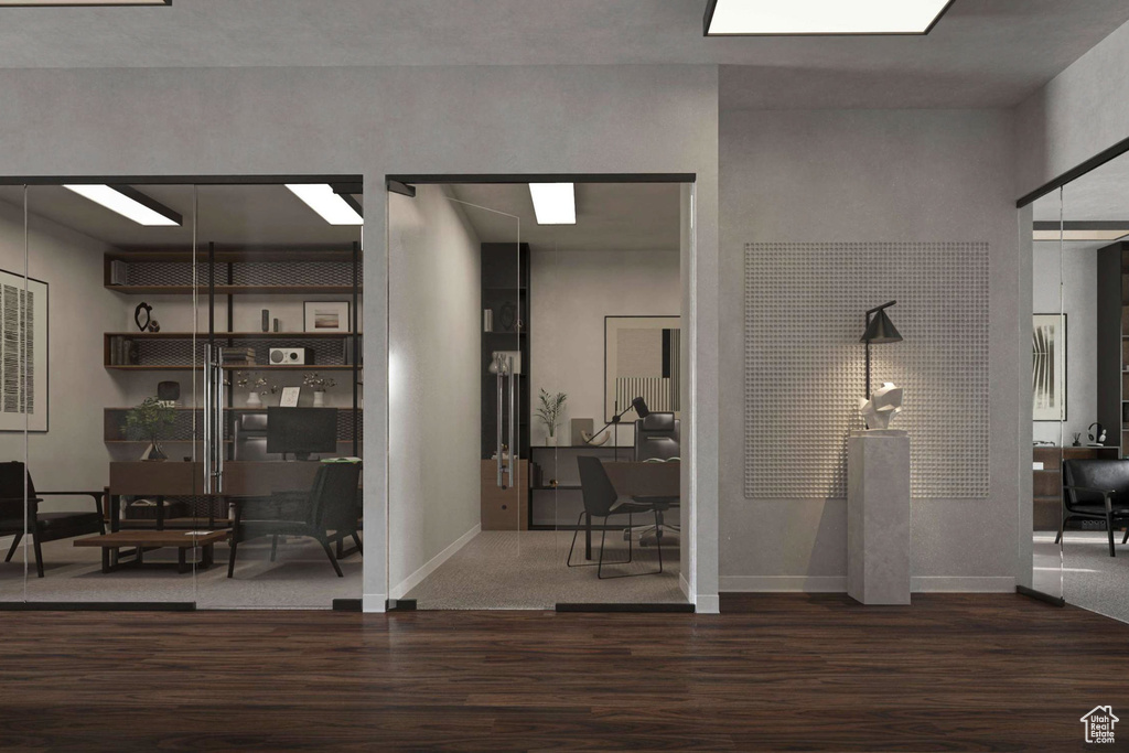 Corridor featuring wood finished floors and baseboards