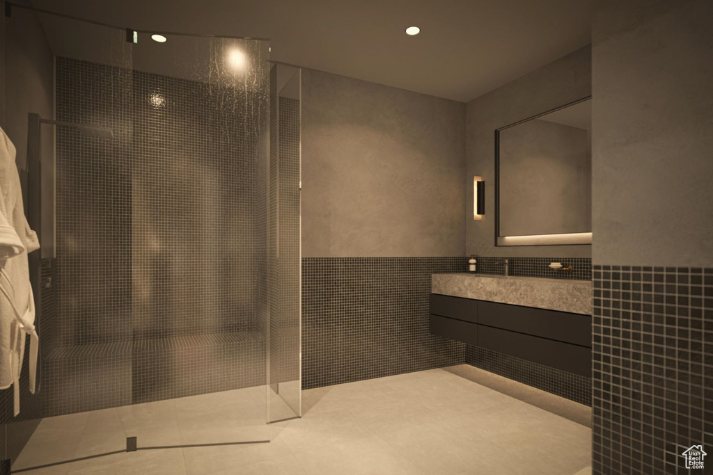 Full bath with tile walls, a walk in shower, vanity, recessed lighting, and tile patterned floors