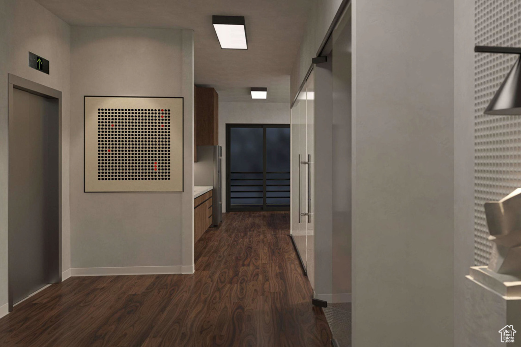 Hallway featuring dark wood finished floors and elevator