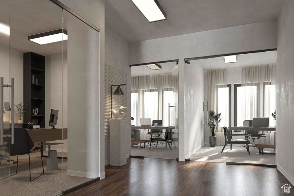 Office featuring wood finished floors and healthy amount of natural light
