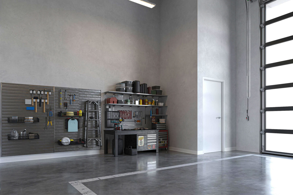 Garage with a workshop area and baseboards