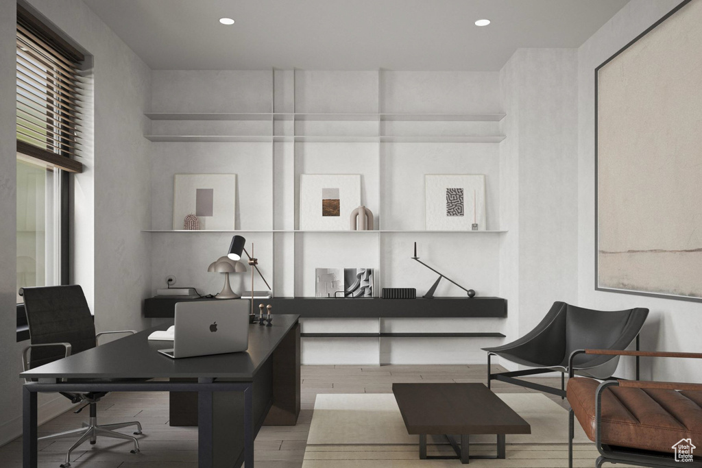 Office space featuring wood finished floors and recessed lighting