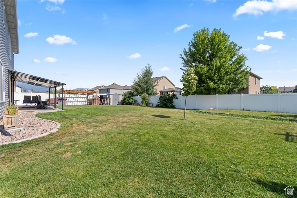 Fenced backyard featuring a patio area