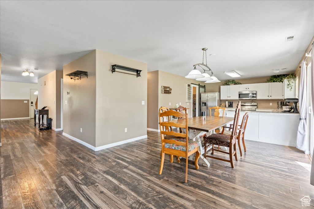 Dining room featuring dark wood finished floors