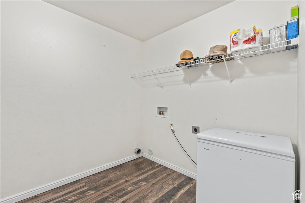 Laundry room featuring washer hookup, dark wood-type flooring, and electric dryer hookup