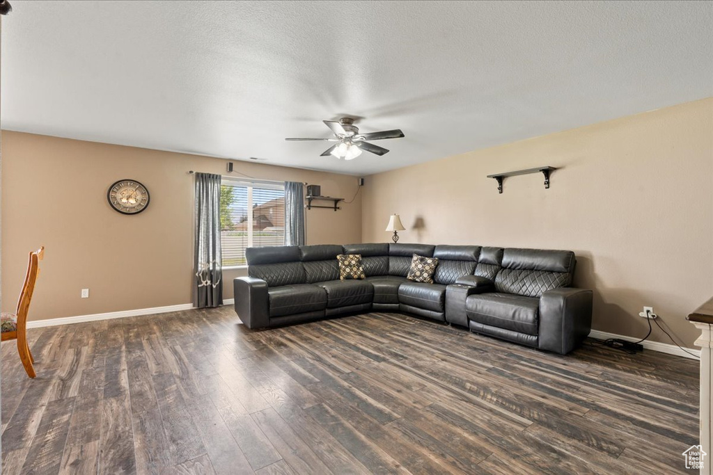 Living room with a ceiling fan and wood finished floors