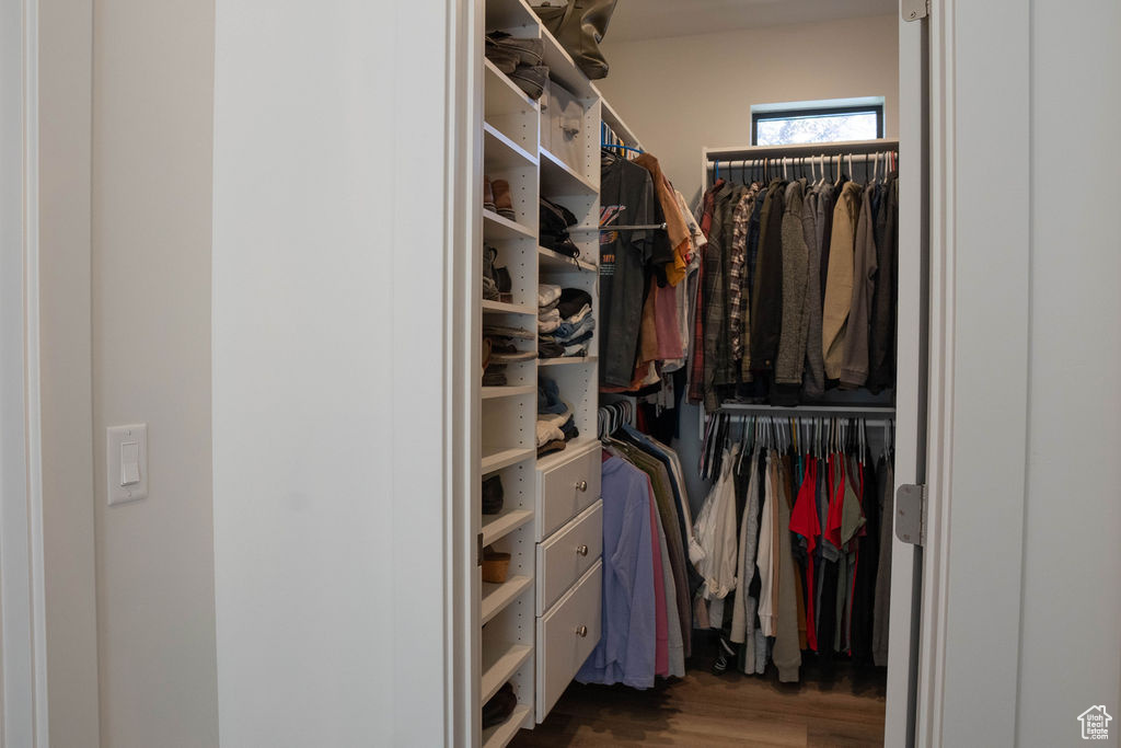 Spacious closet with wood finished floors